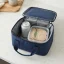 asset_30af7eb71a1a00fd RTIC Ice Lunch Bag open on a light countertop with a drink can and a sandwich container arranged closely inside.